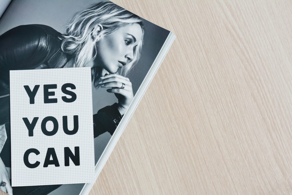 Motivational quote and Jennifer Lawrence in a magazine spread.